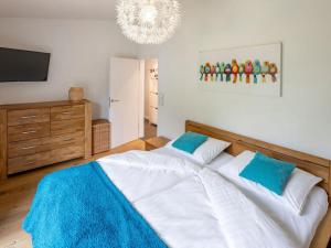 a bedroom with a large bed and a television at Mountain View Modern Retreat in Stryck