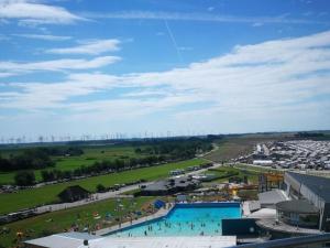 an aerial view of a swimming pool in a field at Holiday apartment Nordnest in Dornum