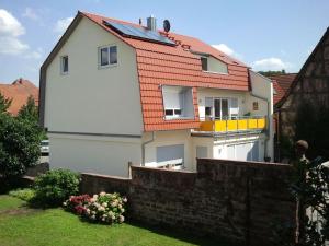 a white house with an orange roof at Holiday home "Max & Moritz" in Bammental