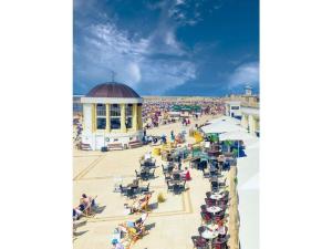 an overhead view of a beach with a crowd of people at Colorful Cow Modern Retreat in Borkum