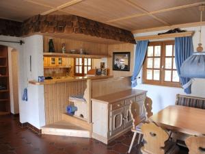 a doll house kitchen with a table and a counter at Panorama Comfortable holiday residence in Hilders