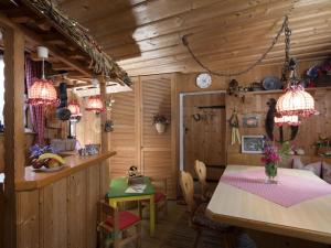 a kitchen and dining room in a log cabin at Valley view in the Ferienhaus Schenk 