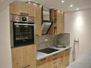Η κουζίνα ή μικρή κουζίνα στο Alpenliebe Comfortable holiday residence +8 φωτογραφίες