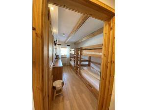 a room with two bunk beds and a chair at Bergglück Modern retreat in Reit im Winkl