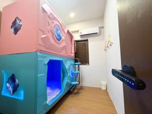 a room with aessori room with a play room with a fish tank at Mana Mana Hotel • Melaka • in Melaka