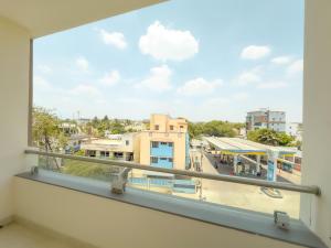 a balcony with a view of a city at TULIP HOMES in Coimbatore