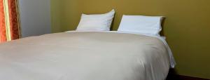 Jisco Hotel Obama Onsen客房内的一张或多张床位