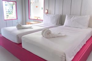 Postel nebo postele na pokoji v ubytování Slumber Resort Koh Chang
