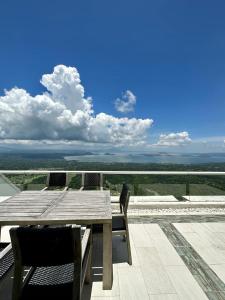 a wooden table sitting on top of a roof at 2 BR Lime Penthouse, Tagaytay Highlands in Tagaytay