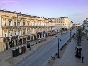 an empty street in a city with buildings at Tiffi Old Town Hotel in Warsaw