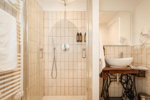 a bathroom with a shower and a sink at La casa di Benedetta in Polignano a Mare
