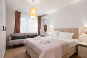 Postel nebo postele na pokoji v ubytování Kovač Family Suites