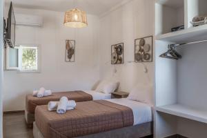 Ένα ή περισσότερα κρεβάτια σε δωμάτιο στο Kleris Apartment 10 Tinos