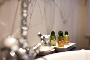 three bottles of beer sitting on a table at Tiffi Old Town Hotel in Warsaw