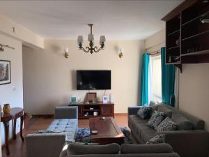 TV a/nebo společenská místnost v ubytování Sweet Home Hattiban