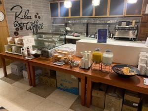 a counter in a kitchen with food on it at Browndot Hotel Incheon Songdo in Incheon