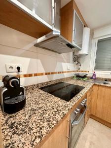 a kitchen with a sink and a counter top at Atardecer en Torre la Sal in Castellón de la Plana
