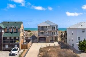 an aerial view of houses and the ocean at 6002 Cedar Sandcastle Semi-Oceanfront Hot Tub in Nags Head