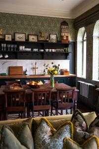 a living room with a couch and a table at Old Town Luxury, By The Sea in Scarborough