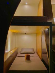 a room with two bunk beds with a cake on top at Mojo Hostel in Puerto Princesa City
