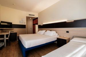 Augustus Hotel Riccione客房内的一张或多张床位