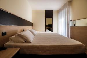 Augustus Hotel Riccione客房内的一张或多张床位