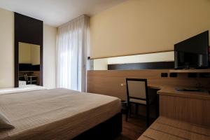 Augustus Hotel Riccione客房内的一张或多张床位