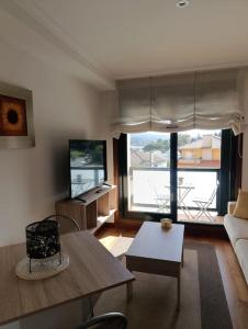 Uma área de estar em Apartamento en Poio-Pontevedra