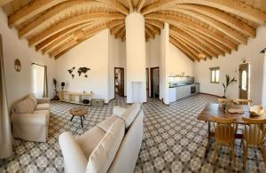a living room with a couch and a table at Alpaca Farm And B&B - Mama Adama in Grândola +28 photos