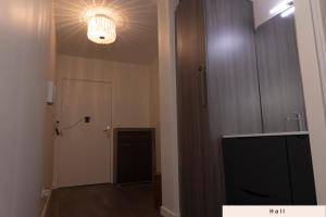 a room with a hallway with a door and a light at Private Room in Coliving - Paris 10min - by Cosynousvoici in Asnières-sur-Seine