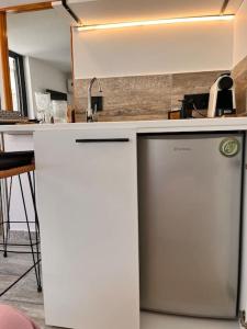 a kitchen with two refrigerators next to a counter at Athena 2 in Athens