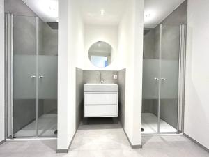 a bathroom with a sink and a mirror at Nice Apartment in Büchenberg in Eichenzell