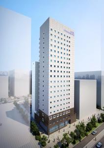 wykonanie wysokiego białego budynku w obiekcie Toyoko Inn Changwon w mieście Changwon