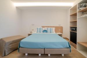 a bedroom with a bed and a couch at Brezza Marina in Maiori