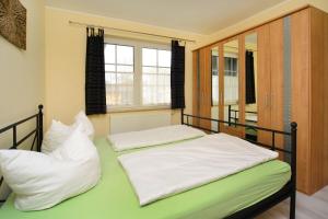 Giường trong phòng chung tại Schulstr 19 Zwergenhaus