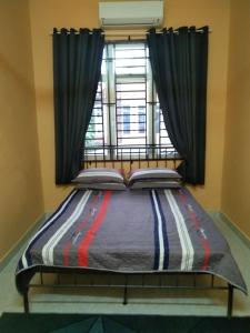 Кровать или кровати в номере CHE SUE HOMESTAY 02
