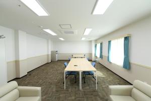 a conference room with a long table and chairs at Toyoko Inn Changwon in Changwon