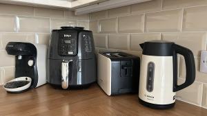 a coffee maker and a coffeemaker sitting on a counter at Little Jem Harlyn Bay near 7 Bays in Saint Merryn