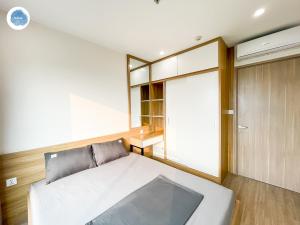 Ένα ή περισσότερα κρεβάτια σε δωμάτιο στο It Dust Homestay 6 - The Forest Apartment