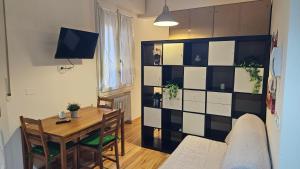 TV a/nebo společenská místnost v ubytování Residenza Ugo Bassi