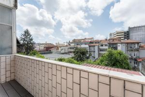 an apartment balcony with a view of a city at GuestReady - Gold Leaf in Porto