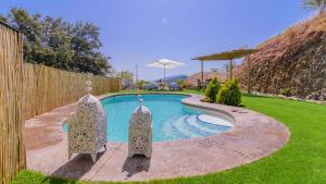 The swimming pool at or close to El Palomar Guaro by Ruralidays