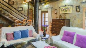 A seating area at El Palomar Guaro by Ruralidays
