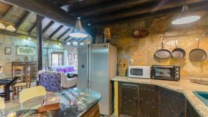 A kitchen or kitchenette at El Palomar Guaro by Ruralidays