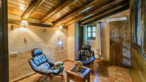 A seating area at El Palomar Guaro by Ruralidays