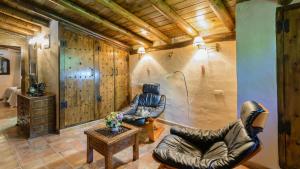 A seating area at El Palomar Guaro by Ruralidays
