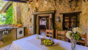 A kitchen or kitchenette at El Palomar Guaro by Ruralidays
