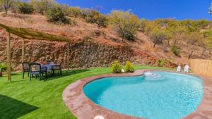 The swimming pool at or close to El Palomar Guaro by Ruralidays