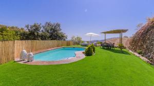 The swimming pool at or close to El Palomar Guaro by Ruralidays