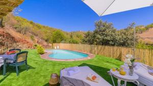 The swimming pool at or close to El Palomar Guaro by Ruralidays